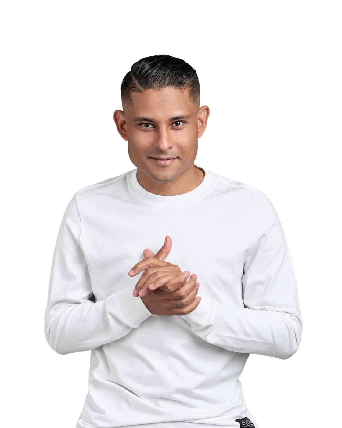 Bruno Stephen in a white top, smiling with hands together