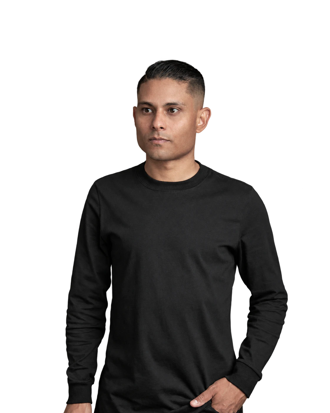 Bruno Stephen in a black top, one hand in a pocket, looking to the side